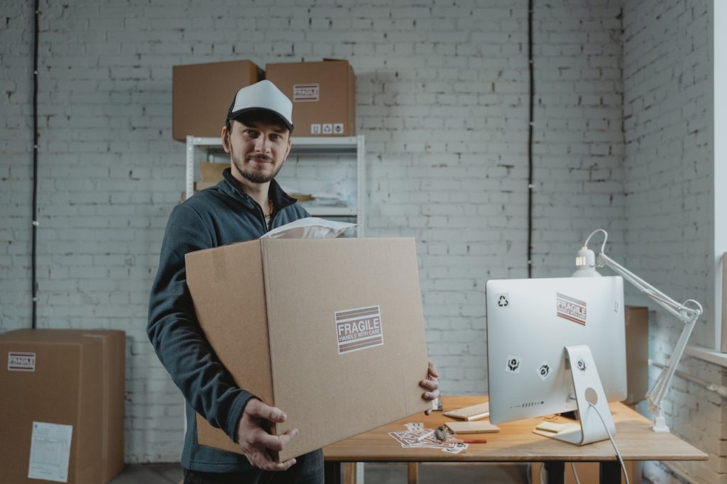 A mover holding box labeled fragile