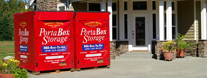 Portabox storage containers in front of a family home after renting pods when moving to Idaho