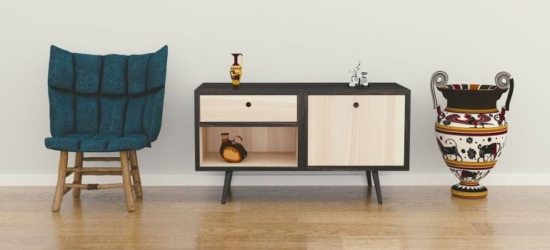 A chair, end table, and a vase to be put in storage units Boise.