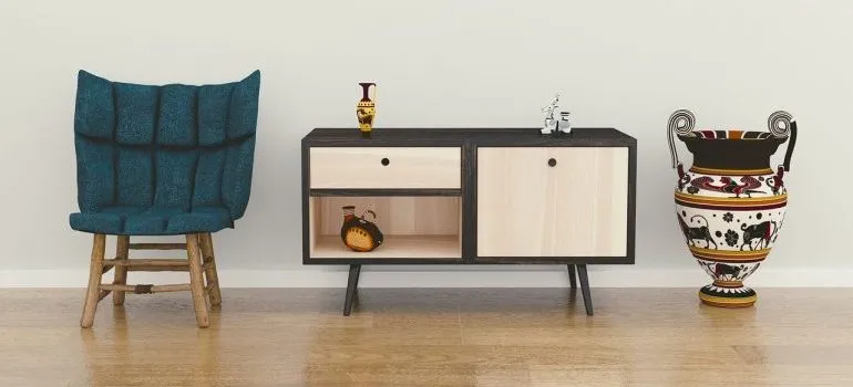A chair, end table, and a vase to be put in storage units Boise.