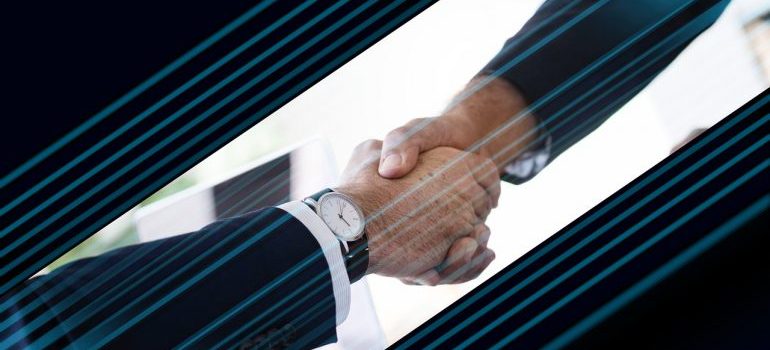 A handshake between two people.
