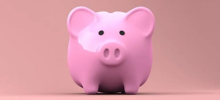 Pink piggy bank in which to save money for your upcoming relocation.