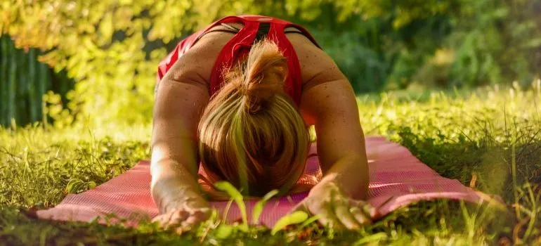 A woman practicing yoga.