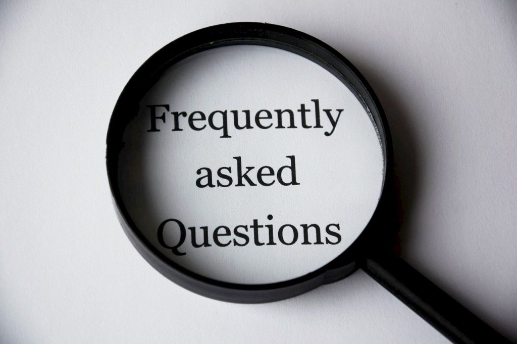 Frequently asked questions under a magnifying glass.