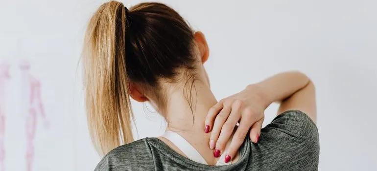 Person rubbing their neck.