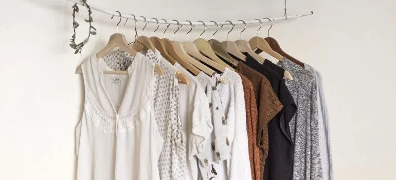 Shirts on hangers to include when getting ready to pack clothes for moving.