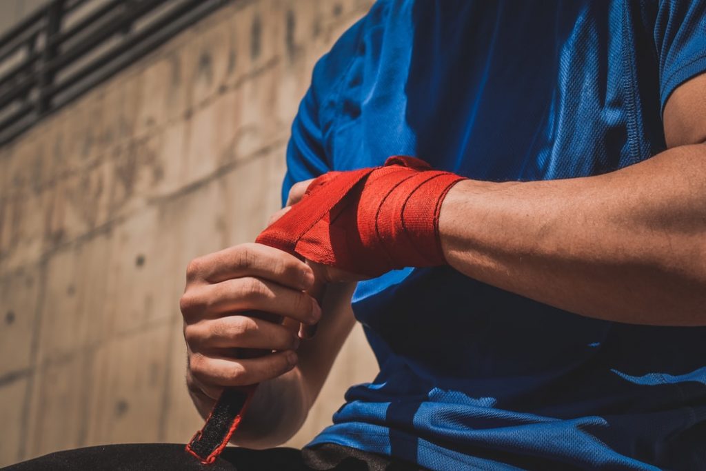 Person wrapping an injured wrist.