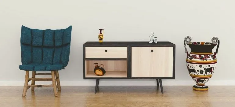 A chair, a vase, and an end table to store in storage pods Boise based.