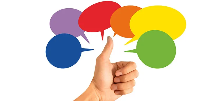 Thumbs up under several illustrated comment clouds