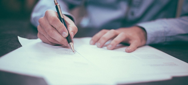 A man writing a list