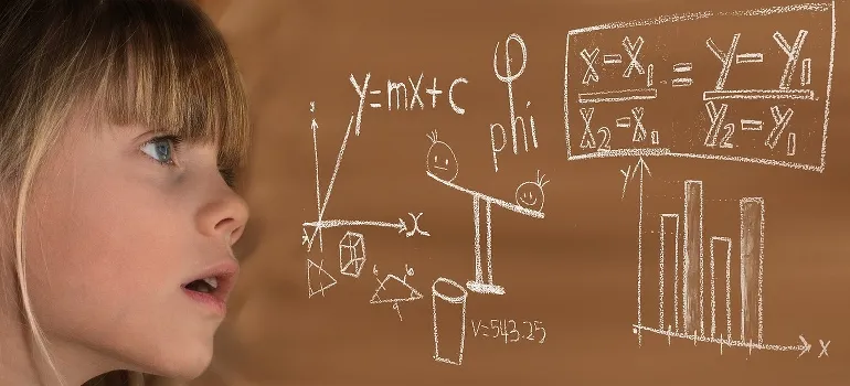A girl looking at some complicated calculations
