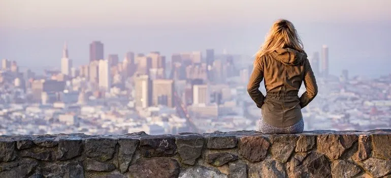 Person watching a city skyline.