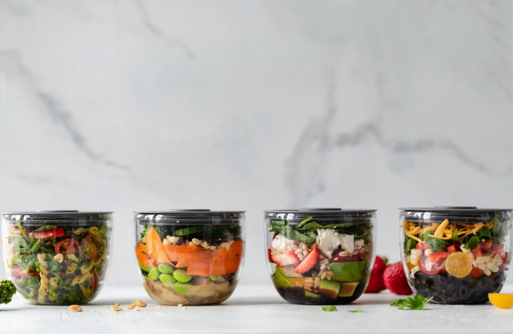 Mason jars with salads.