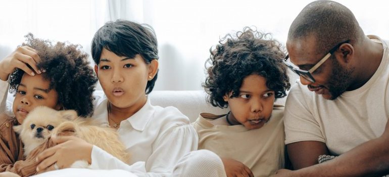 family sitting on the sofa, talking