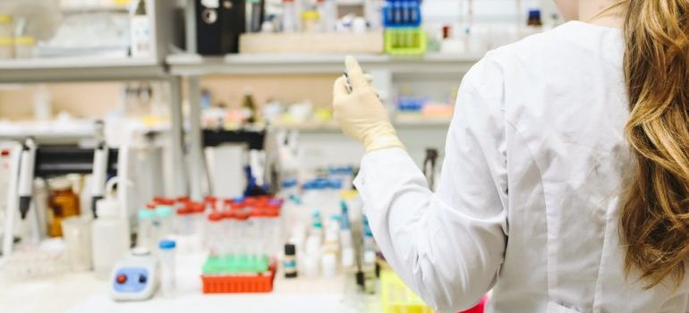 Woman working before relocating a medical lab