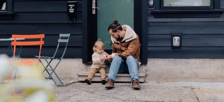 man with a toddler sitting