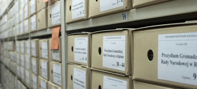 racks in a warehouse loaded with documents and boxes
