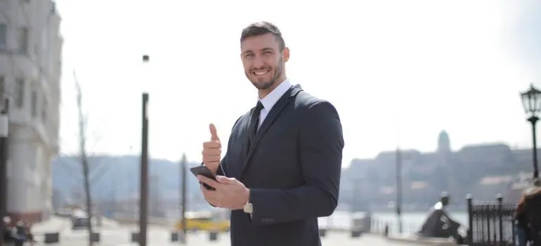 Businessman giving thumbs up