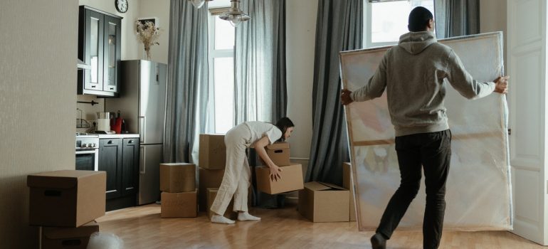 A couple unpacking their home after move
