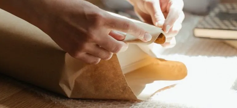 Person packing and moving family heirlooms