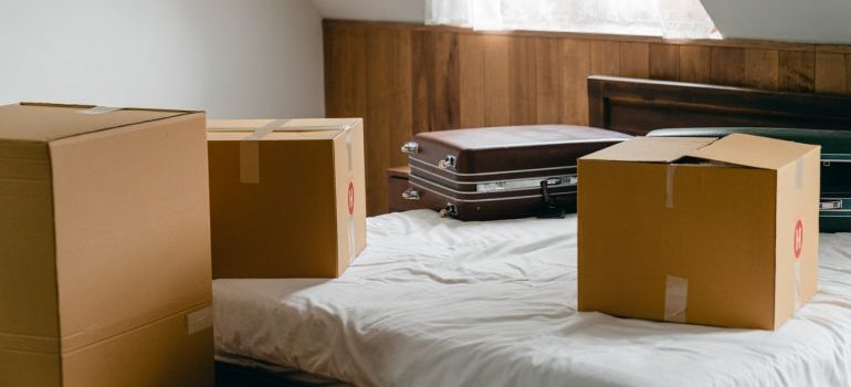 Cardboard boxes and a suitcase