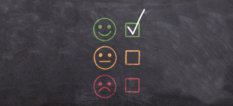 a chalkboard with smiley faces on it