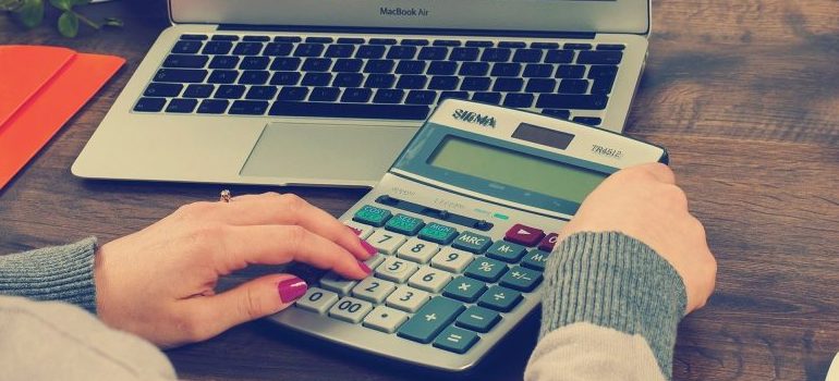 a female person using calculator