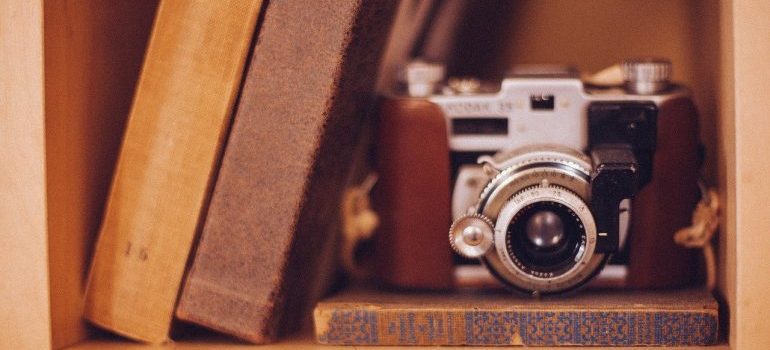 Three books and a camera.