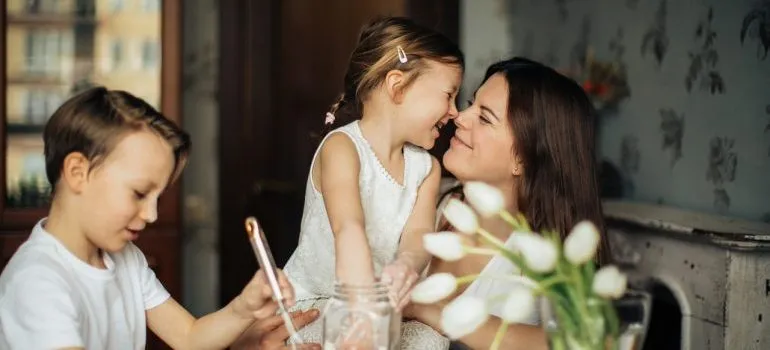 Woman playing with her children