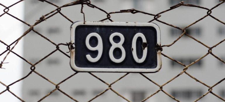 number 980 and barb wire around