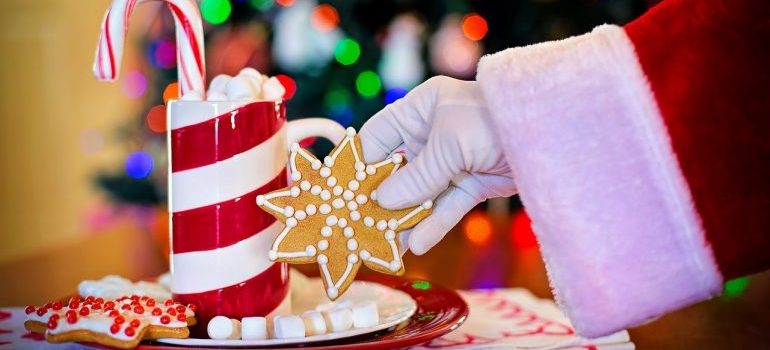 Santa Claus holding cookies.
