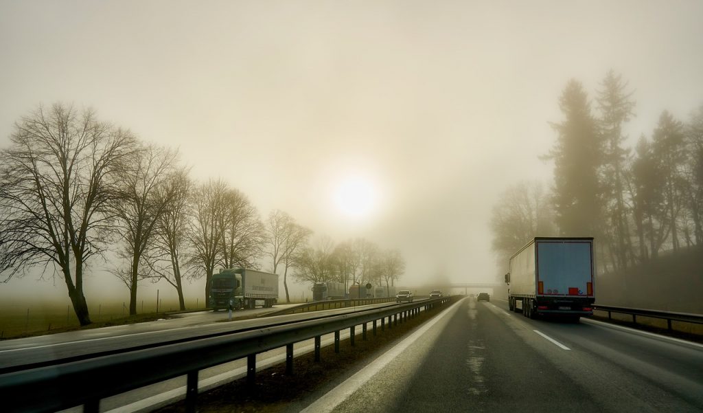 Trucks on the foggy road