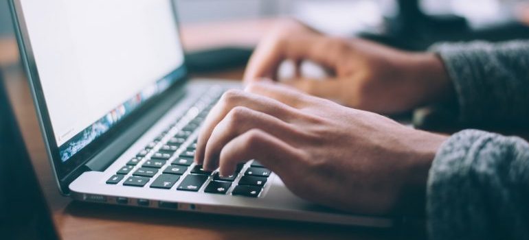 Man researching online about renting storage during COVID-19