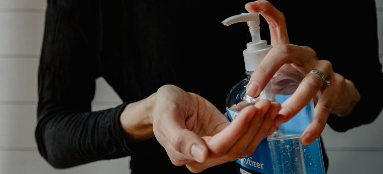 Woman holding hand sanitizer