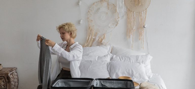 Woman packing clothes