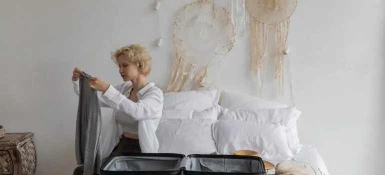 Woman packing clothes