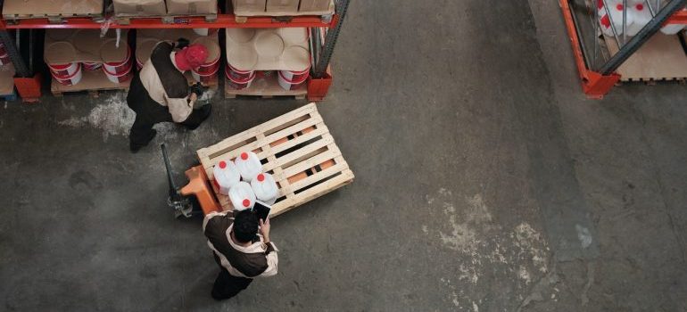 Men checking items inside a warehouse