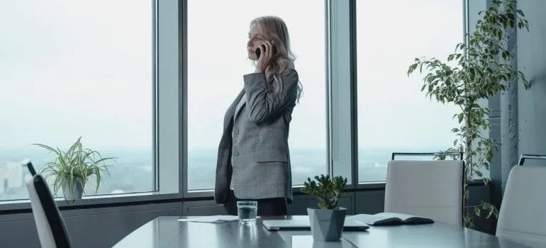 woman in the office, talking on the phone