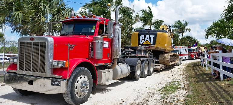 red truck hauling heavy load