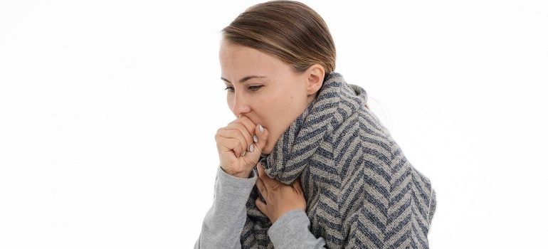 A woman that is coughing.