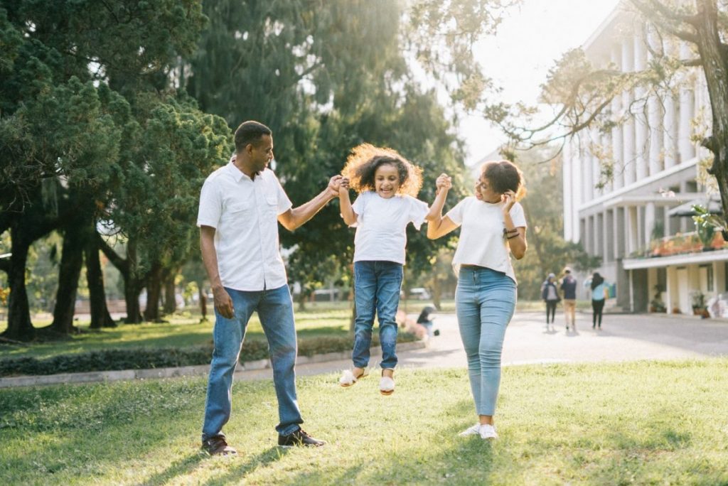 Family playing in park