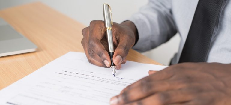 Man signing a document