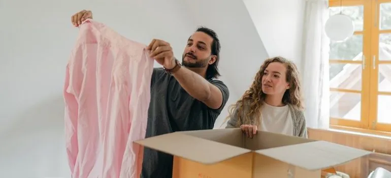 Couple decluttering home during COVID-19