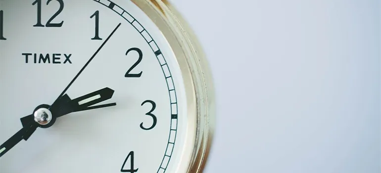 A clock on a white wall