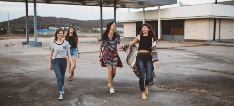 A group of women walking and laughing.