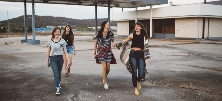 A group of women walking and laughing. 