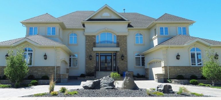 The exterior of a mansion.