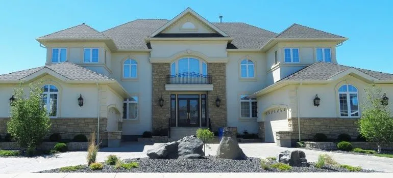 The exterior of a mansion.