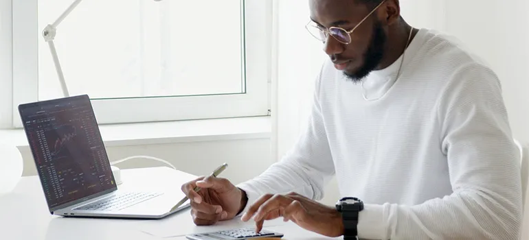 A man getting ready to choose a moving company based on reviews