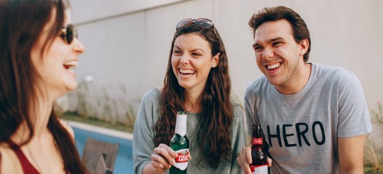 Friends smiling and drinking